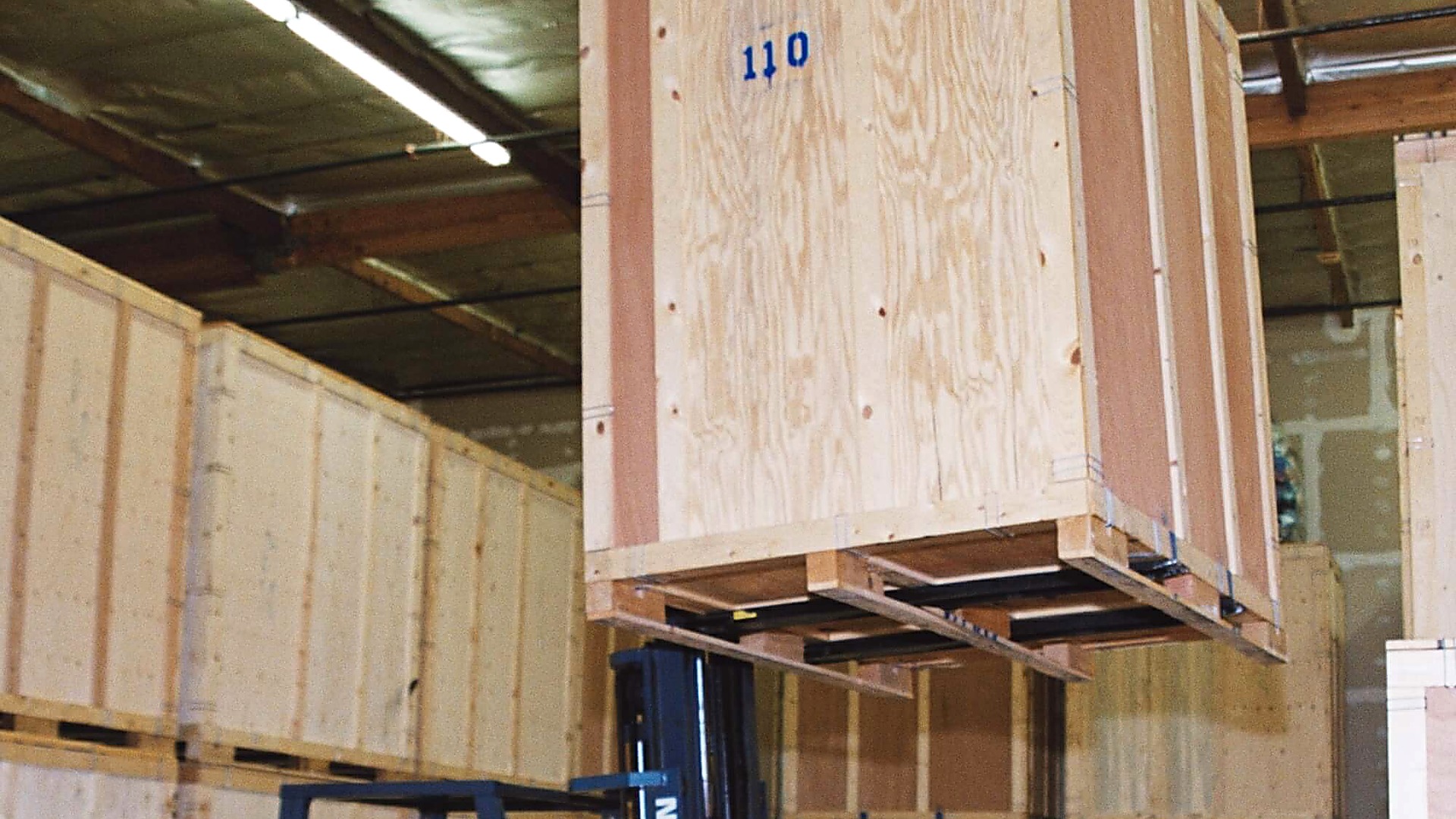 Forklift moving large freight